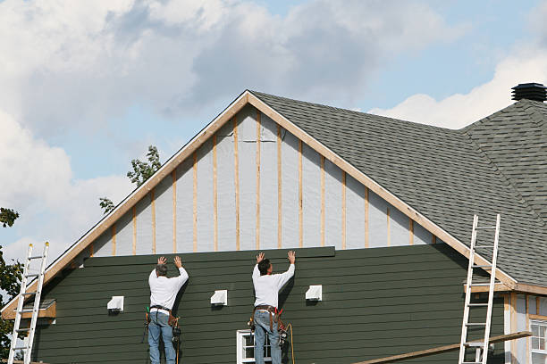 Professional Siding technician working in Haw River, NC